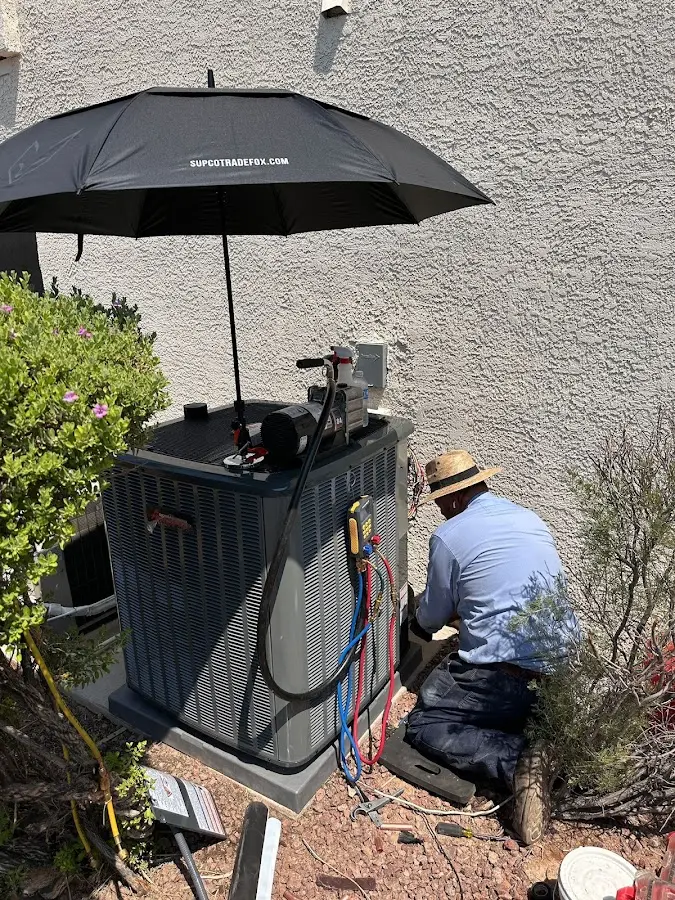 HVAC technician performing outdoor AC maintenance in Rosendale